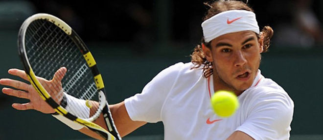 C'est le huitieme titre du Grand Chelem gagne par Rafael Nadal (C) AFP PHOTO/ADRIAN DENNIS