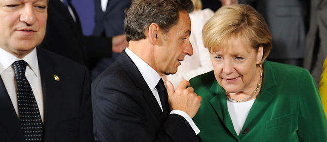 Jose Manuel Barroso et Nicolas Sarkozy ont eu un "echange tres violent" lors du sommet europeen a Bruxelles, sur fond de polemique au sujet des Roms (C) AFP PHOTO