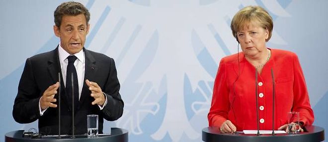 Nicolas Sarkozy et Angela Merkel s'opposaient jusqu'a present sur les modalites de participation du secteur prive au sauvetage grec.