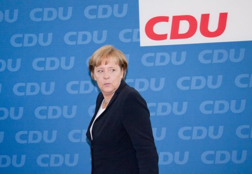 La coalition gouvernementale d'Angela Merkel pansait ses plaies lundi apres un nouveau vote sanction pour les conservateurs et une debacle des liberaux dans l'Etat regional de la chanceliere allemande.