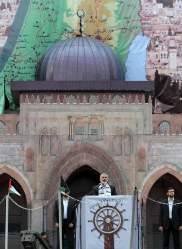 Ismail Haniya, Palestinian Hamas leader in the Gaza Strip, speaks in front of a model of Jerusalem's Al-Aqsa Mosque as he addresses the Islamist movement's supporters during celebrations in Gaza City for the 24th anniversary of its foundation on December 14, 2011. AFP PHOTO/SAID KHATIB