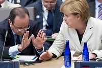 Francois Hollande et Angela Merkel lors du sommet de l'Otan le 21 mai. (C)Saul Loeb