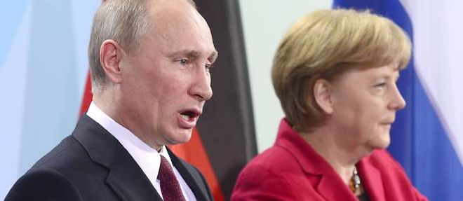 Vladimir Poutine et Angela Merkel.
