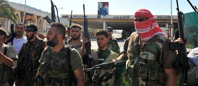 Parmi les rebelles qui se sont empares vendredi du poste-frontiere turco-syrien de Bab al-Hawa, figuraient des salafistes.