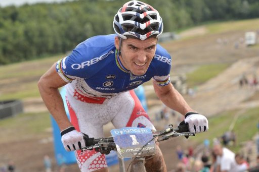 French Julien Absalon of team Orbea rides his bike for first place during the final stage of the Belgacom Belgian MTB Grand Prix, in Boom August 4, 2012. AFP PHOTO / BELGA PHOTO / DAVID STOCKMAN