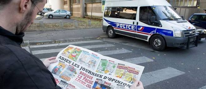 A Paris, la securite a ete renforcee autour de l'immeuble abritant la redaction de "Charlie Hebdo", victime d'un incendie criminel en novembre 2011 apres la publication de dessins representant Mahomet.