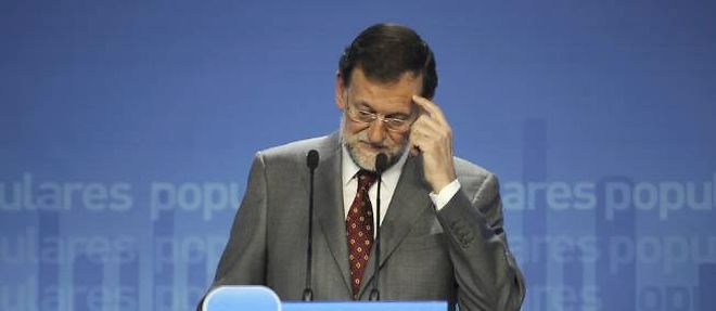 Le chef du gouvernement conservateur, Mariano Rajoy, veut empecher a tout prix que les Espagnols aient l'impression d'avoir ete places sous tutelle.