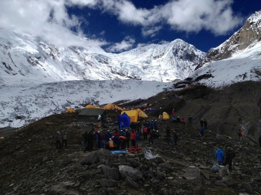 In this handout photograph released by Nepalese helicopter aviation service Simrik Air, rescuers are pictured at a site following an avalance at the Mount Manaslu base camp in Gorkha Districtst on September 23, 2012. At least nine climbers including a German and a local guide have been killed in Nepal after they were buried by an avalanche on one of the world's most deadly mountains, officials said september 23. AFP PHOTO/SIMRIK AIR ----EDITOR'S NOTE---- RESTRICTED TO EDITORIAL USE MANDATORY CREDIT "AFP PHOTO/SIMRIK AIR" NO MARKETING NO ADVERTISING CAMPAIGNS - DISTRIBUTED AS A SERVICE TO CLIEN