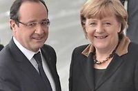 Francois Hollande et Angela Merkel. (C)BERTRAND LANGLOIS / AFP