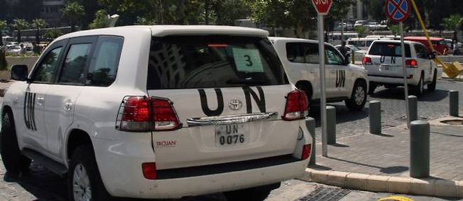 Les vehicules de l'ONU a Damas, lundi matin.