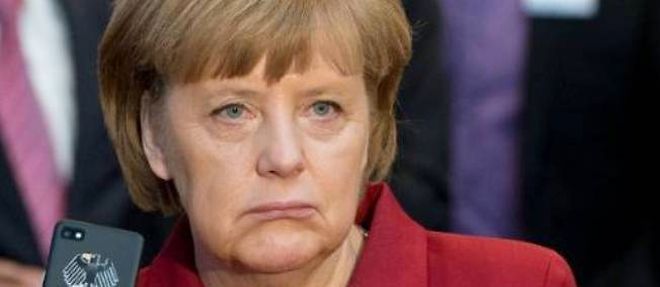 Angela Merkel a accepte la proposition des sociaux-democrates de sa grande coalition d'instaurer progressivement un salaire minimum national.