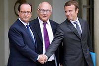 Francois Hollande, Michel Sapin et Emmanuel Macron, mercredi a l'Elysee. (C)Bertrand Guay / AFP