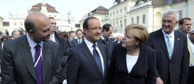 Pierre Moscovici et Angela Merkel en 2012.
