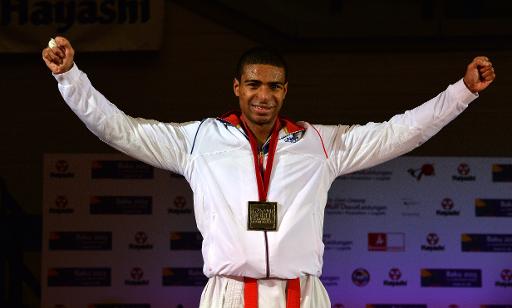 Le Francais William Rolle, medaille d'or dans la categorie des -67kg aux Mondiaux-2014 de Breme, le 8 novembre a l'OVB Arena