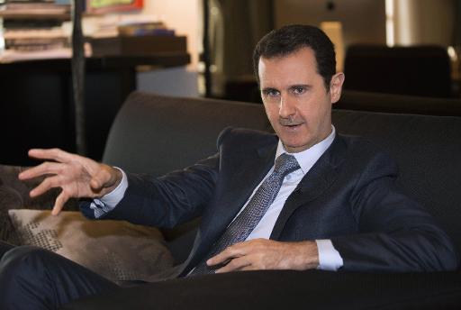 Photo transmise par l'agence Sana du président syrien Bashar al-Assad donnant une interview à "Paris Match" à Damas le 3 décembre 2014 ©  Sana/AFP