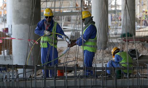 Des migrants employés sur un chantier le 3 octobre 2013 à Doha © Karim Jaafar Al-Watan Doha/AFP/Archives