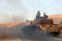 Un tank de l'armee libanaise a l'entree de la ville d'Ersal, pres de la frontiere syrienne, le 2 aout 2014. (C)AFP PHOTO / STR