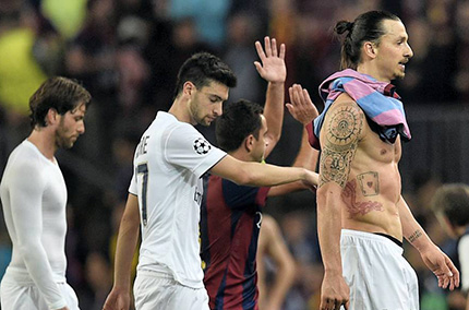Le PSG, largement éliminé par le Barça en quart de finale de la Ligue des champions ©  LLUIS GENE / AFP