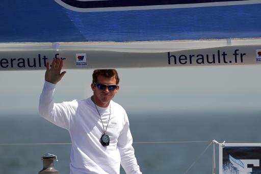 Le skipper francais Xavier Macaire a la barre du Herault, le 8 juin 2014 a Deauville