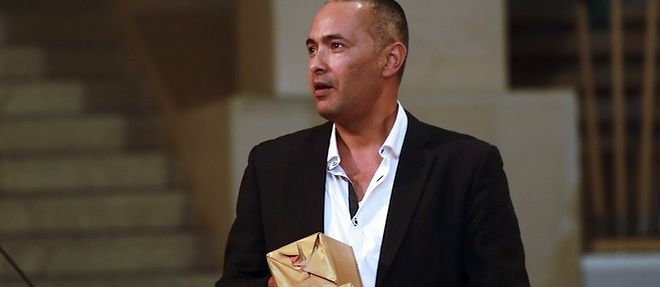 Le journaliste et ecrivain Kamel Daoud recevant le Prix Francois-Mauriac 2014 pour son roman "Meursault, contre-enquete".