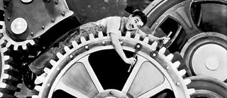 Charlie Chaplin dans Les Temps modernes (1936). 