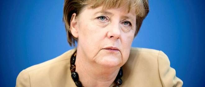 Angela Merkel fait face a une grogne sans precedent en pres              de dix ans de pouvoir en Allemagne du fait de sa politique d'ouverture  aux refugies.