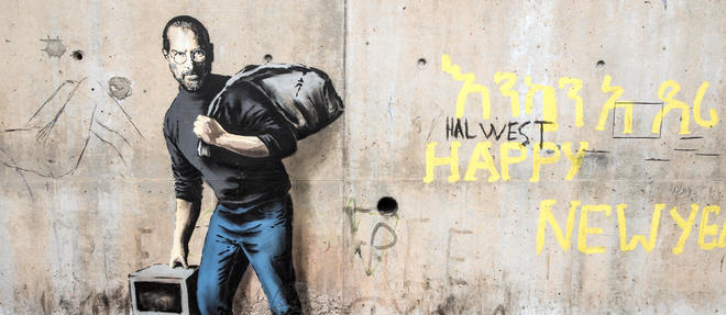 Graffiti de Bansky representant Steve Jobs. Photo prise le 12 decembre 2015. AFP / PHILIPPE HUGUEN 