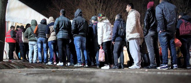 Des demandeurs d'asile a Berlin le 21 decembre 2015 AFP / dpa / Kay Nietfeld / Germany OUT