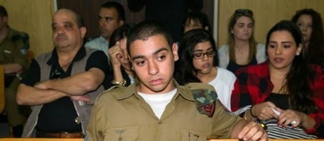 Le soldat israelien Elor Azria -ici le 5 avril 2016 devant un tribunal militaire a Tel Aviv- inculpe lundi d'homicide par la justice militaire pour avoir achever un assaillant palestinien blesse en Cisjordanie occupee