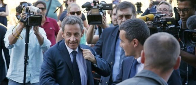 Nicolas Sarkozy arrive a son nouveau QG de campagne a Paris le 23 aout 2016