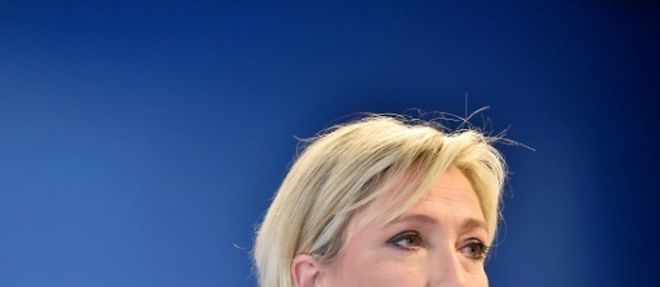 La presidente du Front National (FN) Marine Le Pen holds, a Nanterre, pres de Paris, le 16 juillet 2016