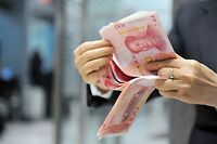 La masse monétaire chinoise associée au ralentissement de l'activité du pays sont la principale source d'inquiétude pour l'économie mondiale. ©Hu jianhuang