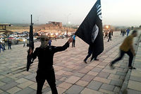Combattant de Daech lors de la prise de Mossoul par l'Etat islamique en juin 2014. 