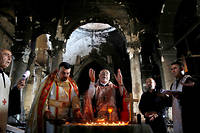 Symbole. Dans les ruines de l'eglise de l'Immaculee Conception, le 30 octobre, la premiere messe dominicale est celebree depuis la liberation de Qaraqosh huit jours plus tot. (C)Ahmed Jadallah / Reuters