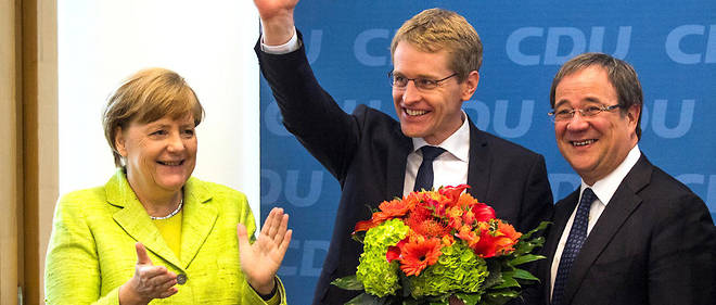 De gauche a droite, la chanceliere Angela Merkel, le candidat de la CDU en Schleswig-Holstein Daniel Gunther et celui en Rhenanie-du-Nord-Westphalie Armin Laschet.