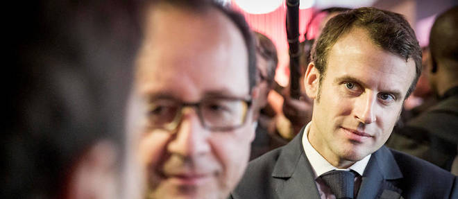 Francois Hollande, president de la Republique, et Emmanuel Macron, ministre de l'Economie, de l'Industrie et du Numerique, au Mondial de l'auto,  porte de Versailles a Paris, vendredi 3 octobre 2014.