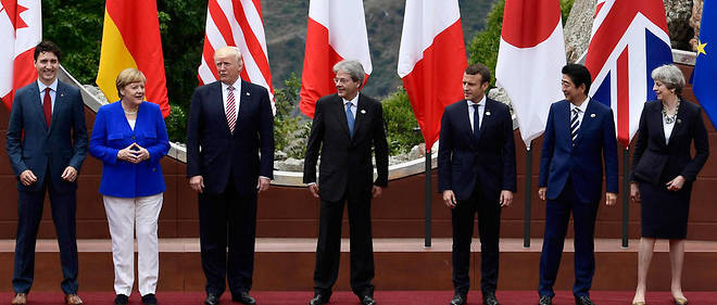 De gauche a droite, le Canadien Justin Trudeau, l'Allemande Angela Merkel, l'Americain Donald Trump, l'Italien Paolo Gentiloni, le Francais Emmanuel Macron, le Japonais Shinzo Abe et la Britannique Theresa May.  