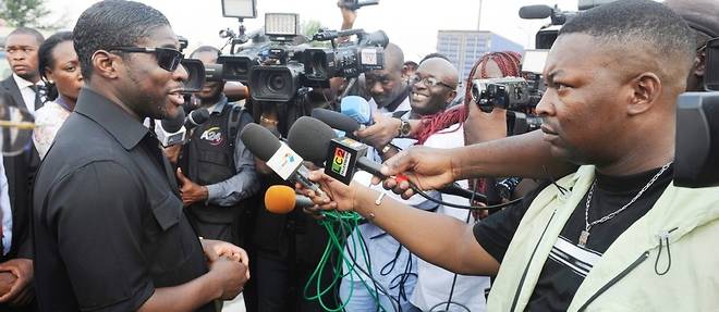 Teodorin Obiang, fils du president equato-guineen, parle a des journalistes le 23 decembre 2014 a Malabo en Guinee equatoriale.