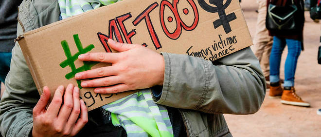 FRANCE, Lyon: A protesters holds a placard reading #Metoo during a gathering against gender-based and sexual violence in Lyon on October 29, 2017. #MeToo hashtag, is the campaign encouraging women to denounce experiences of sexual abuse that has swept across social media in the wake of the wave of allegations targeting a Hollywood producer. - Franck CHAPOLARD