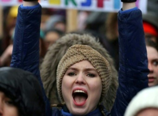 Une femme manifeste devant Downing Street pour exprimer leur ras-le-bol face au harcèlement sexuel, aux violences et aux discriminations subies par les femmes, à Londres le 21 janvier 2018 © Daniel LEAL-OLIVAS AFP