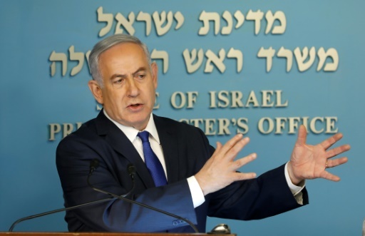 Le Premier ministre israélien Benjamin Netanyahu annonçant un accord avec l'ONU sur des migrants africains, le 2 avril 2018 à Jérusalem © Menahem KAHANA AFP