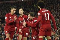  La joie de Roberto Firmino et des joueurs de Liverpool, plus que jamais en lice pour le titre de champion d'Angleterre (football) après leur écrasante victoire contre Arsenal (5-1).   ©PAUL ELLIS