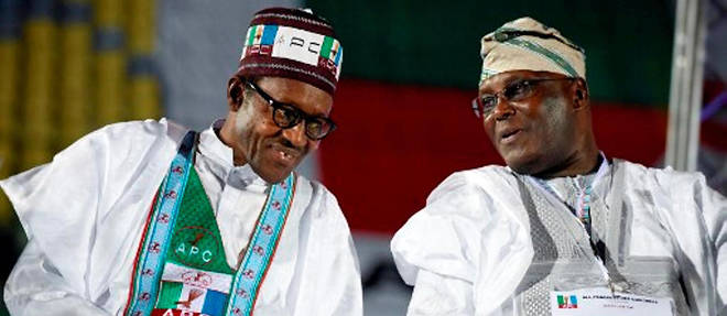 Le duel entre Muhammadu Buhari et Atiku Abubakar, ici cote a cote le 1er decembre 2014, s'annonce apre.