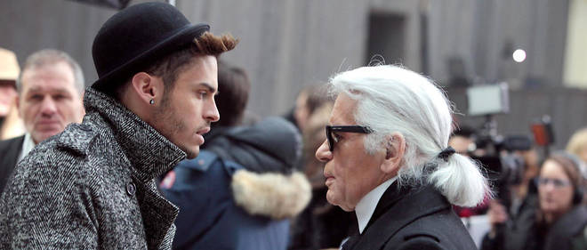 Karl Lagerfeld et son protege, le mannequin francais Baptiste Giabiconi.