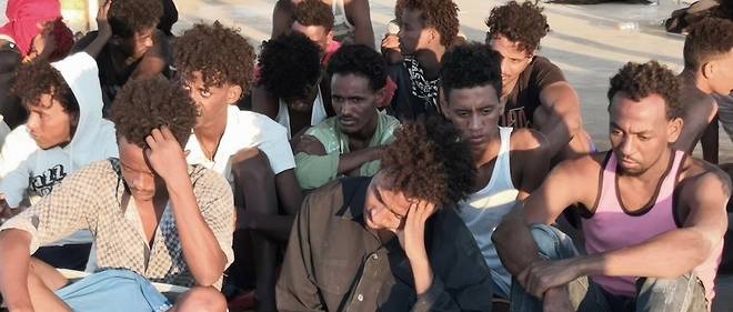 KHOMS, LIBYA - JULY 25 : A group of irregular migrants, rescued by Libyan Coastal Guard, wait after a boat sank off the city of Al-Khoms, Libya 5 miles from the coast on July 25, 2019. At least 150 irregular migrants were reported missing.  Hazem Turkia  / Anadolu Agency, KHOMS, LIBYA - JULY 25 : A group of irregular migrants, rescued by Libyan Coastal Guard, wait after a boat sank off the city of Al-Khoms, Libya 5 miles from the coast on July 25, 2019. At least 150 irregular migrants were reported missing. Hazem Turkia / Anadolu Agency