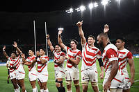 Japan's players celebrate after winning the Japan 2019 Rugby World Cup Pool A match between Japan and Ireland at the Shizuoka Stadium Ecopa in Shizuoka on September 28, 2019. (Photo by Anne-Christine POUJOULAT / AFP)