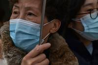 Epid&eacute;mie: la Chine confine des villes, mais pas d'alerte internationale
