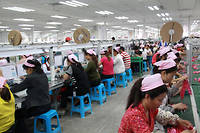 Une ligne de production chez Foxconn dans le nord de la Chine en 2012. La plus grande usine du monde vient de se lancer dans la production de masques de protection.

