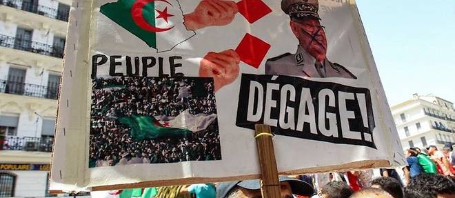 
Manifestation a Alger le 12 juillet 2019. Le militaire represente sur la pancarte est le chef d'etat-major.

