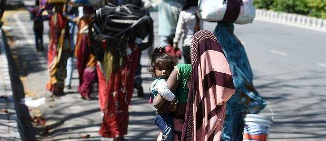 Inde: la longue marche des travailleurs migrants pieges par le confinement